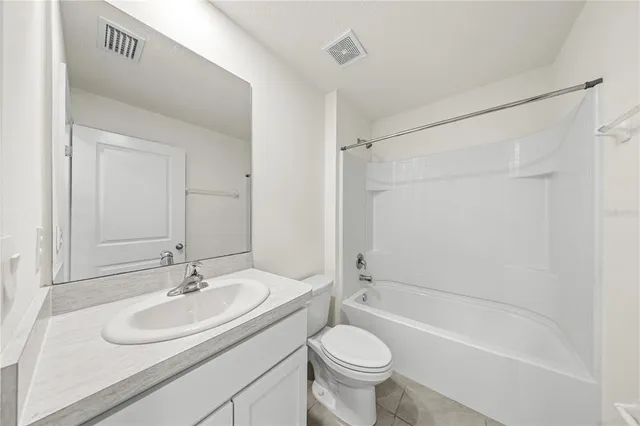 a bathroom with a sink toilet a mirror and shower