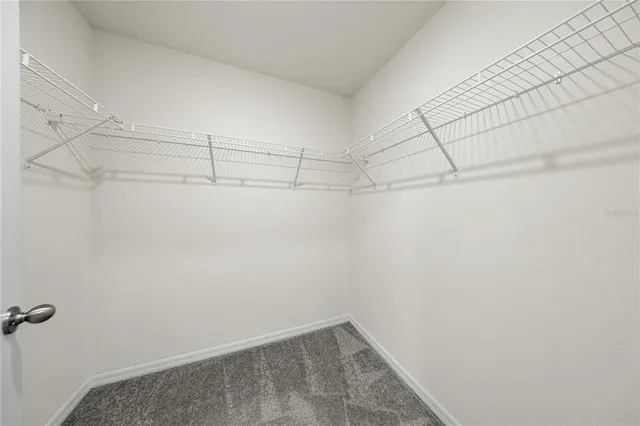 a bathroom with a double vanity sink and mirror