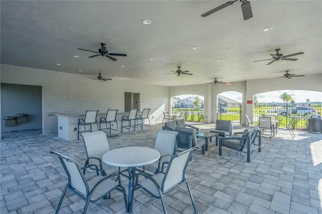 an aerial view of a house with swimming pool and outdoor space