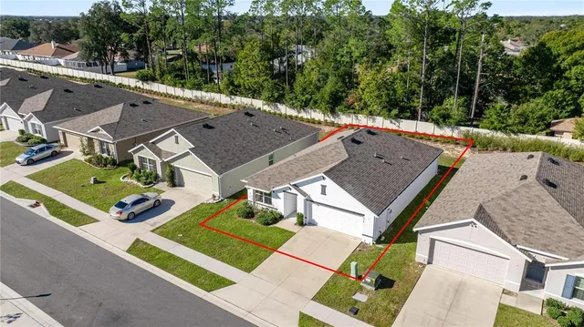 an aerial view of a house with a garden