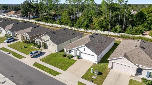 an aerial view of a house with a garden