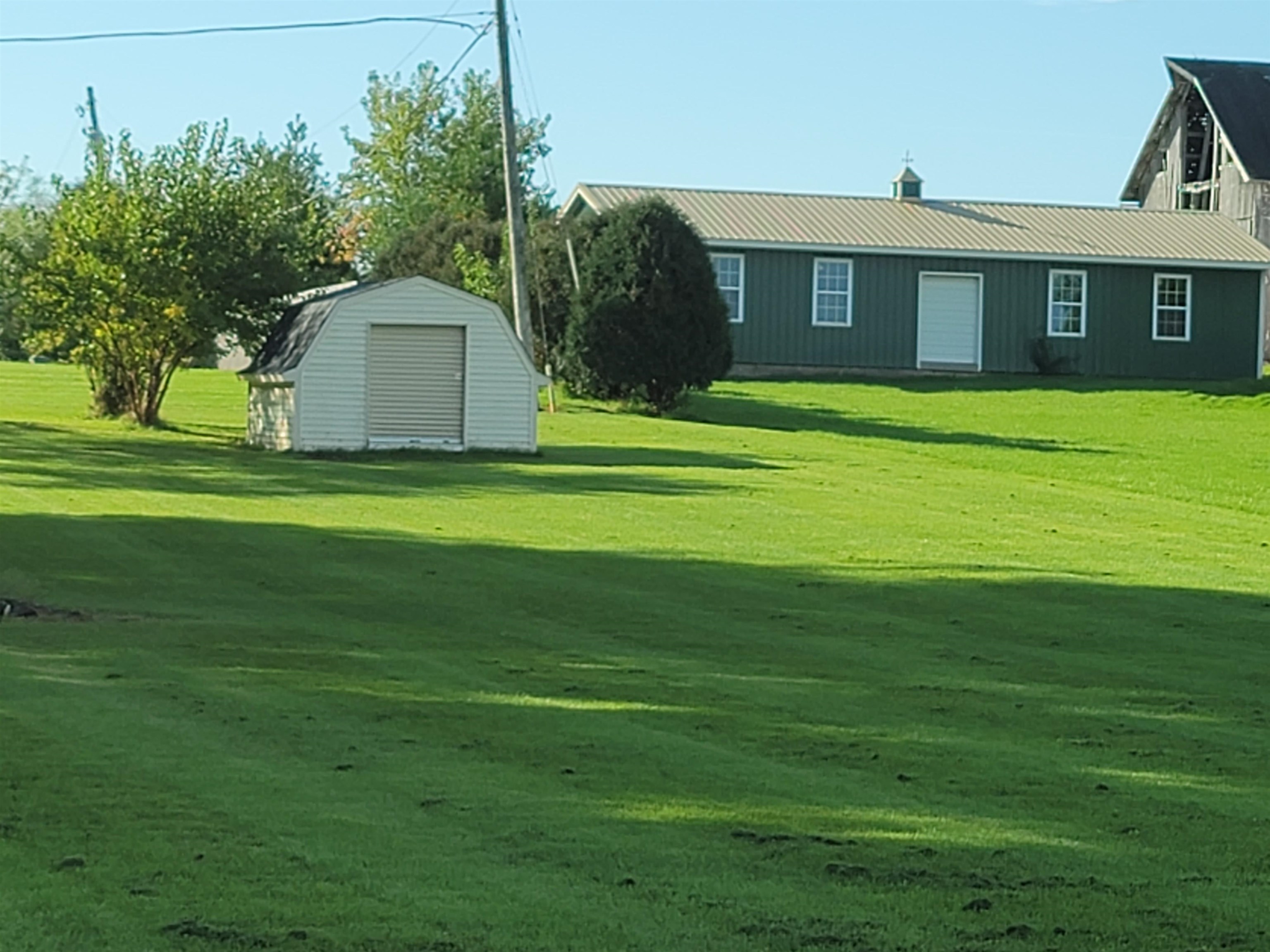2349 Graham Road Belvidere, IL 61008 - Photo 2 of 5 a front view of a house with a garden