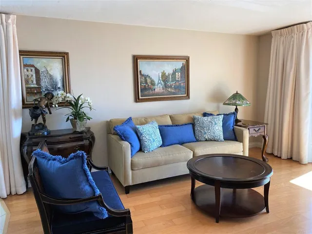 a kitchen with a table chairs and microwave
