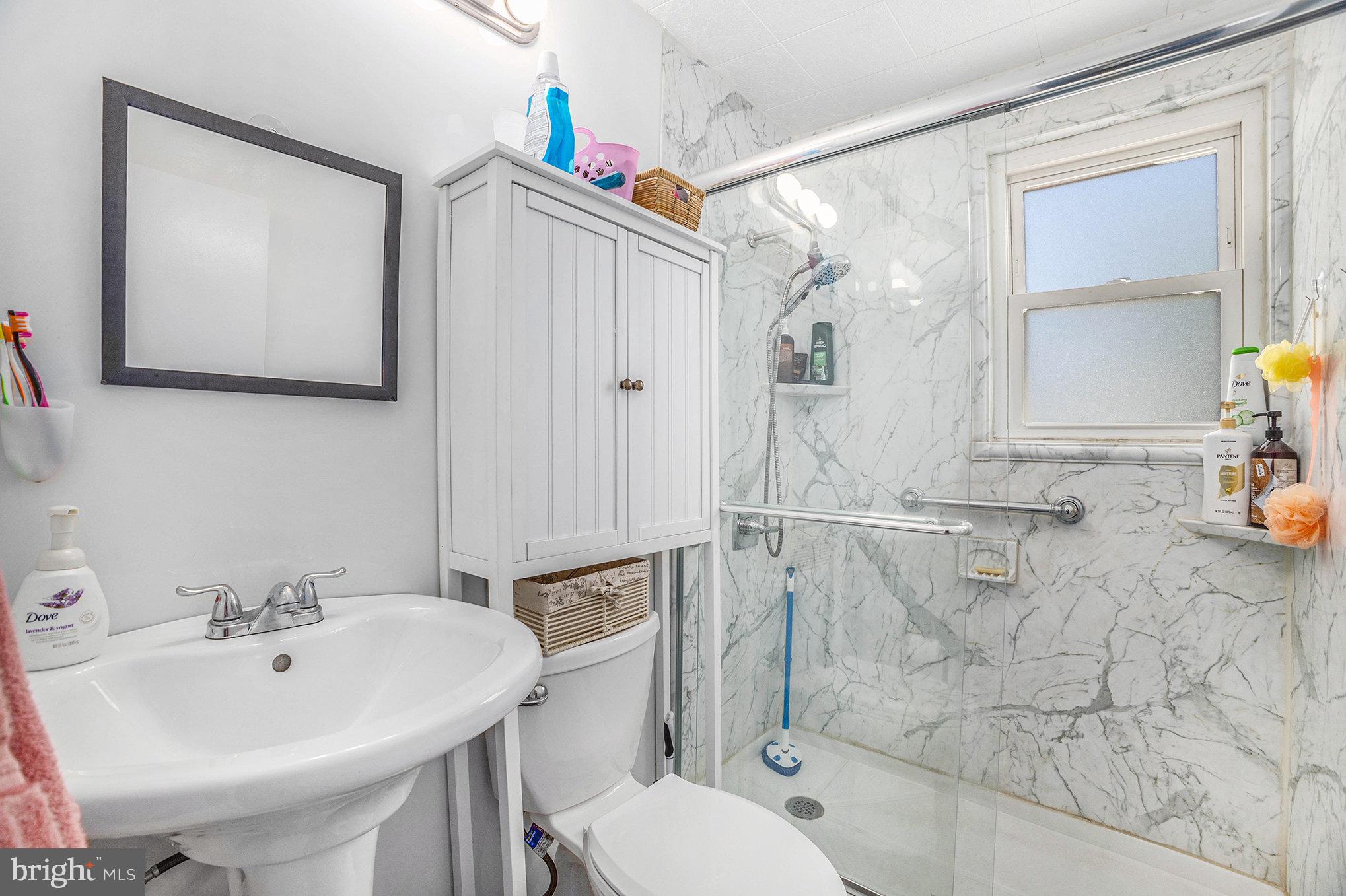 25 Constitution Avenue Eagleville, PA 19403 - Photo 14 of 24 a bathroom with a sink toilet and shower