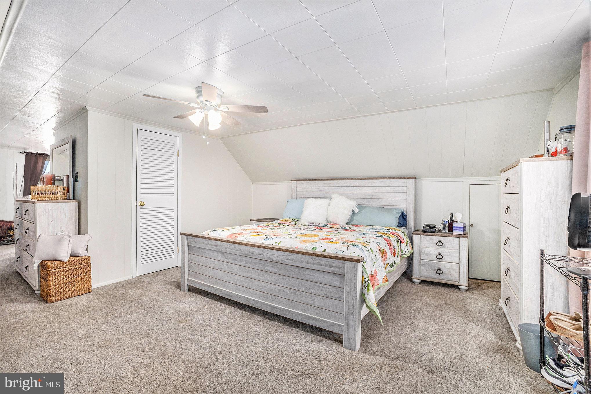 25 Constitution Avenue Eagleville, PA 19403 - Photo 15 of 24 a bedroom with a bed and a chandelier