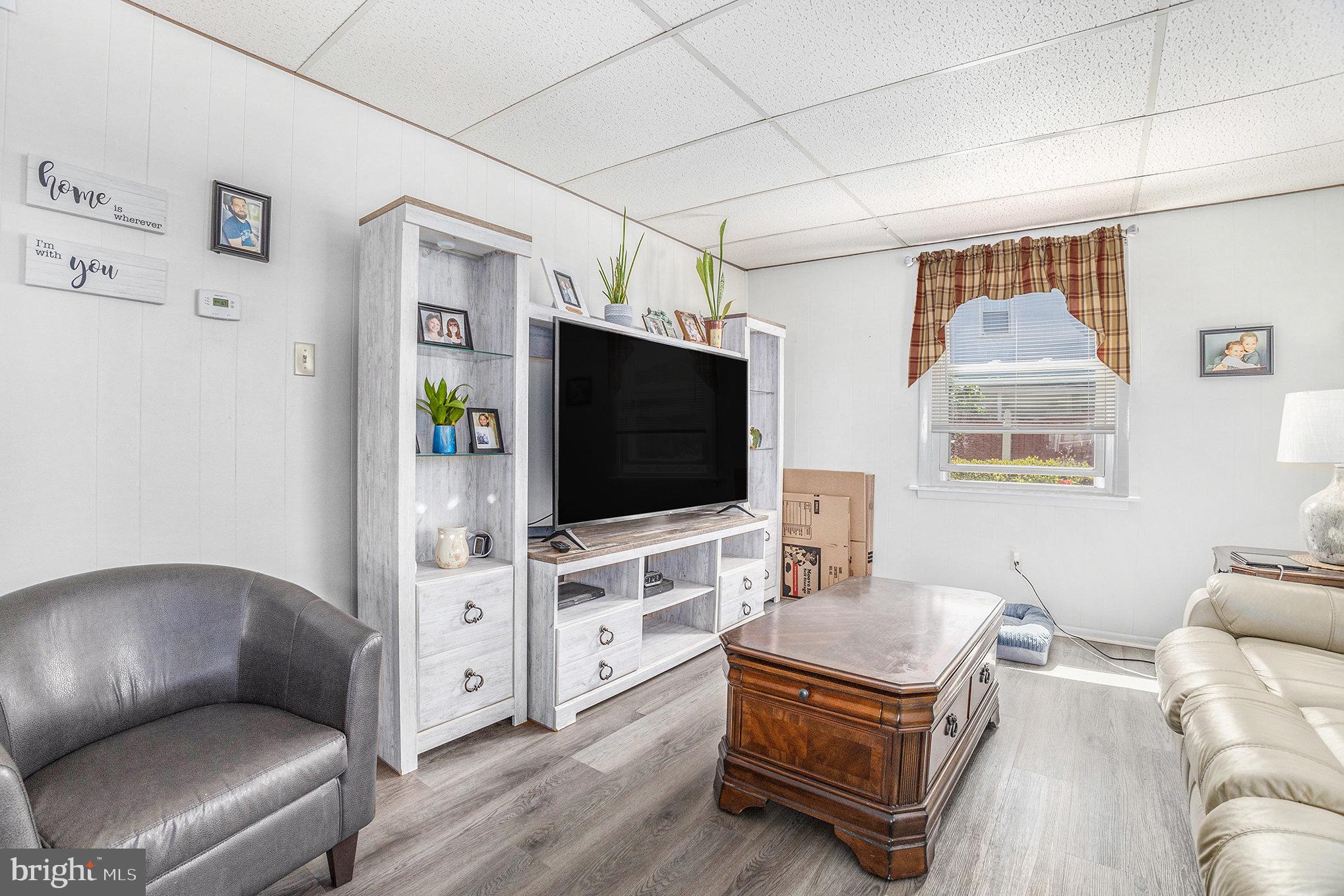25 Constitution Avenue Eagleville, PA 19403 - Photo 5 of 24 a living room with furniture and a flat screen tv