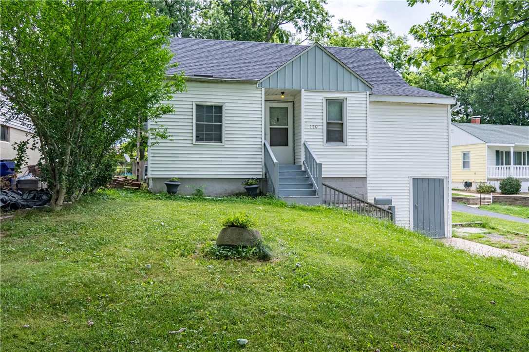 550 Sheridan Drive Decatur, IL 62521 - Photo 2 of 21 a front view of house with yard and trees
