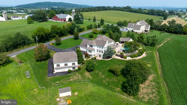 a front view of a house with a garden and plants