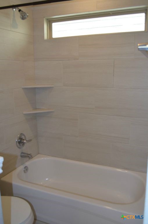 3414 Addison Street Killeen, TX 76542 - Photo 21 of 36 a bathroom with a bathtub