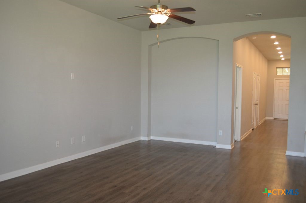 3414 Addison Street Killeen, TX 76542 - Photo 27 of 36 a view of a room with wooden floor and chandelier fan