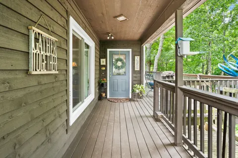 a view of balcony with wooden floor