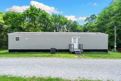 a backyard of a house with lots of green space