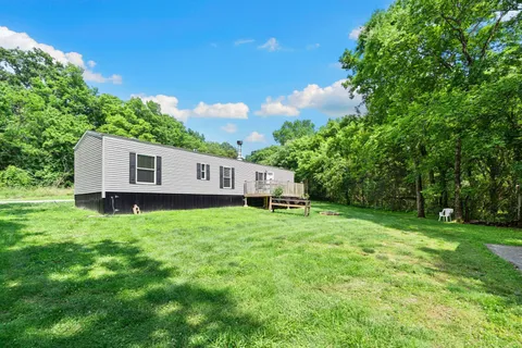 a kitchen with stainless steel appliances granite countertop a stove sink and cabinets