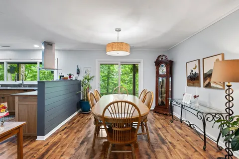 a view of a dining room with furniture window and outside view