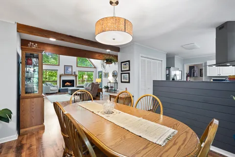 a kitchen with lots of counter top space and wooden floor
