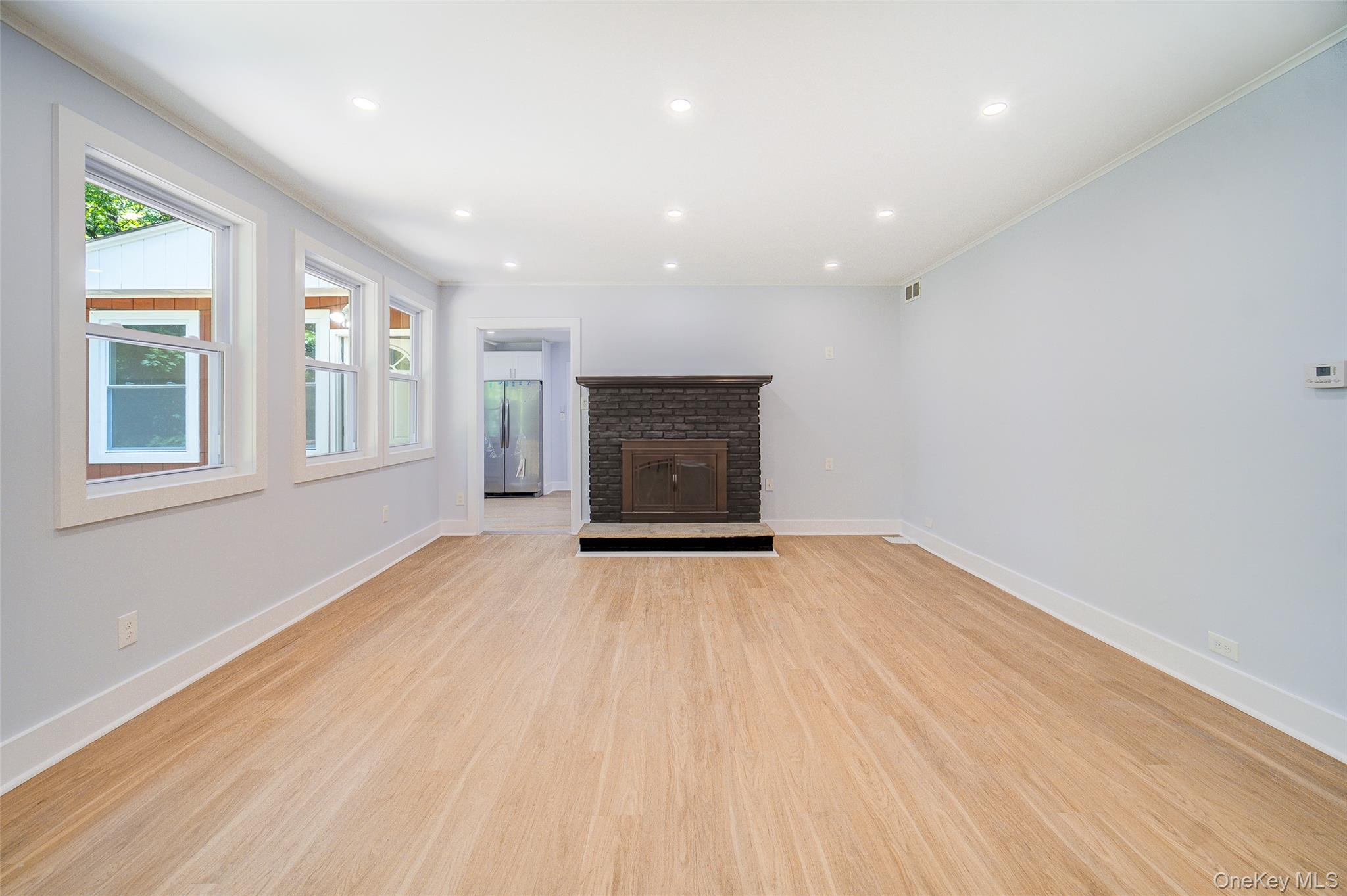 219 Benedict Road Montgomery, NY 12549 - Photo 7 of 50 a view of an empty room with wooden floor and a window