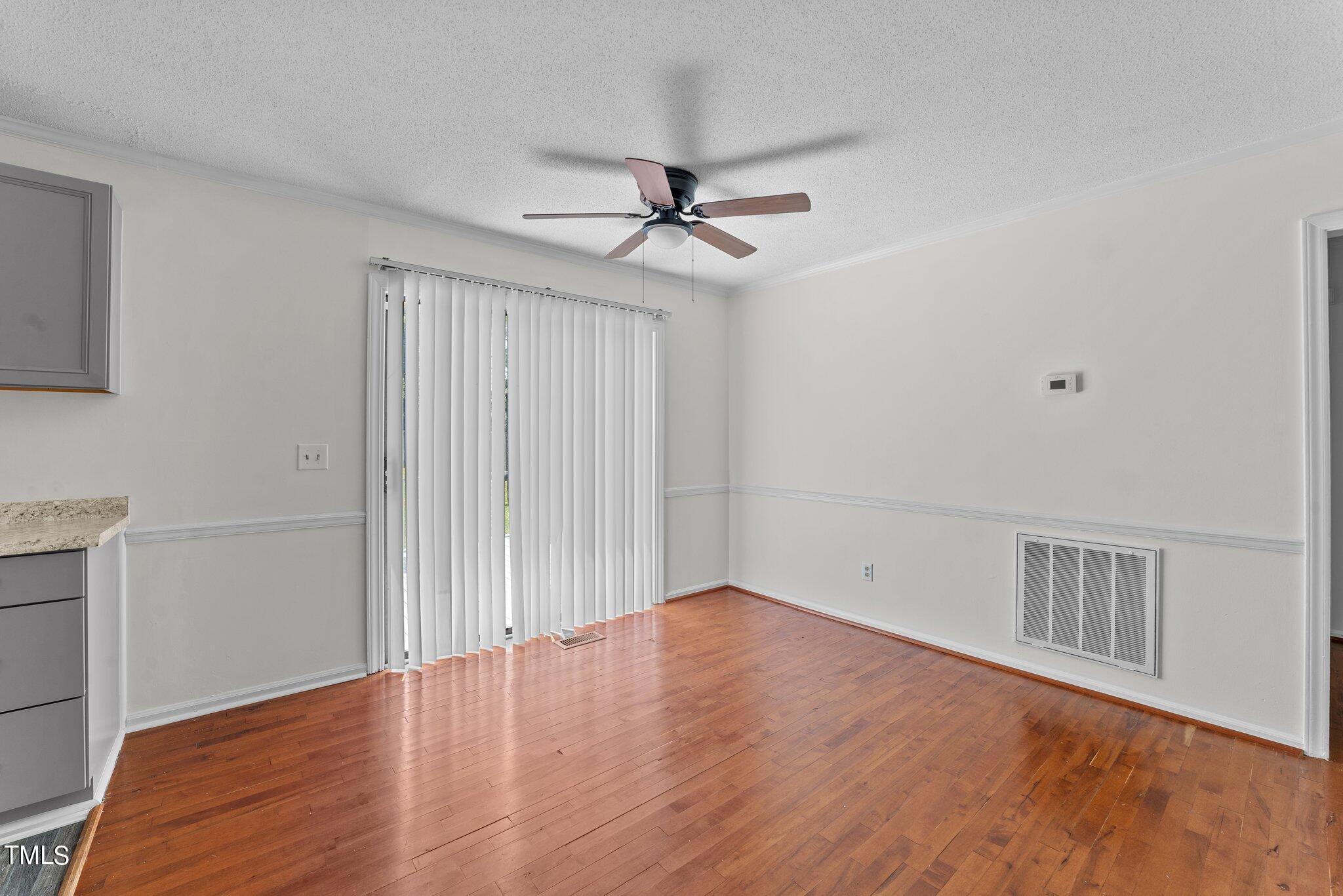 207 Freestone Road Greenville, NC 27834 - Photo 11 of 45 wooden floor in an empty room with a window