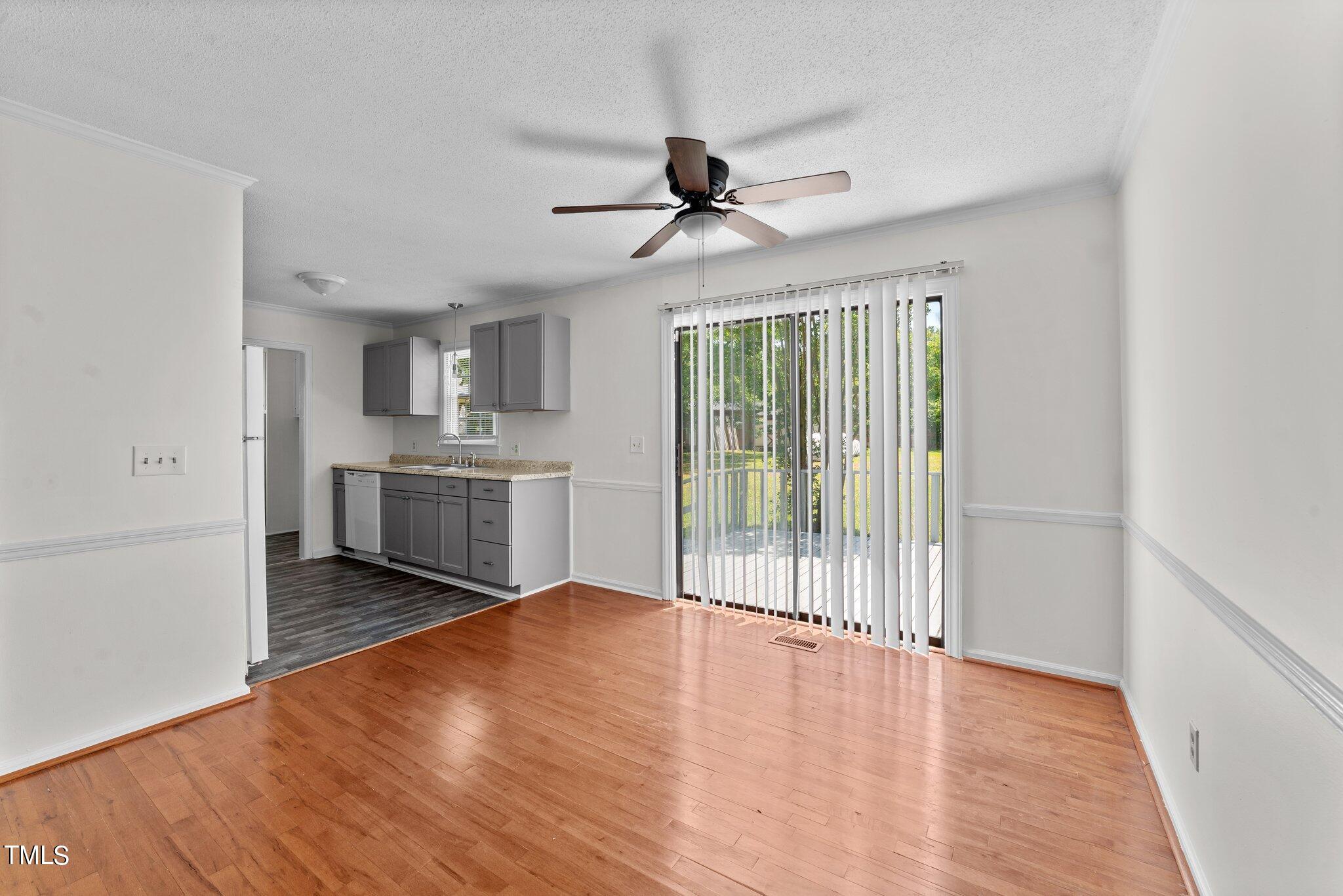 207 Freestone Road Greenville, NC 27834 - Photo 12 of 45 a view of a kitchen with a stove cabinets and wooden floor