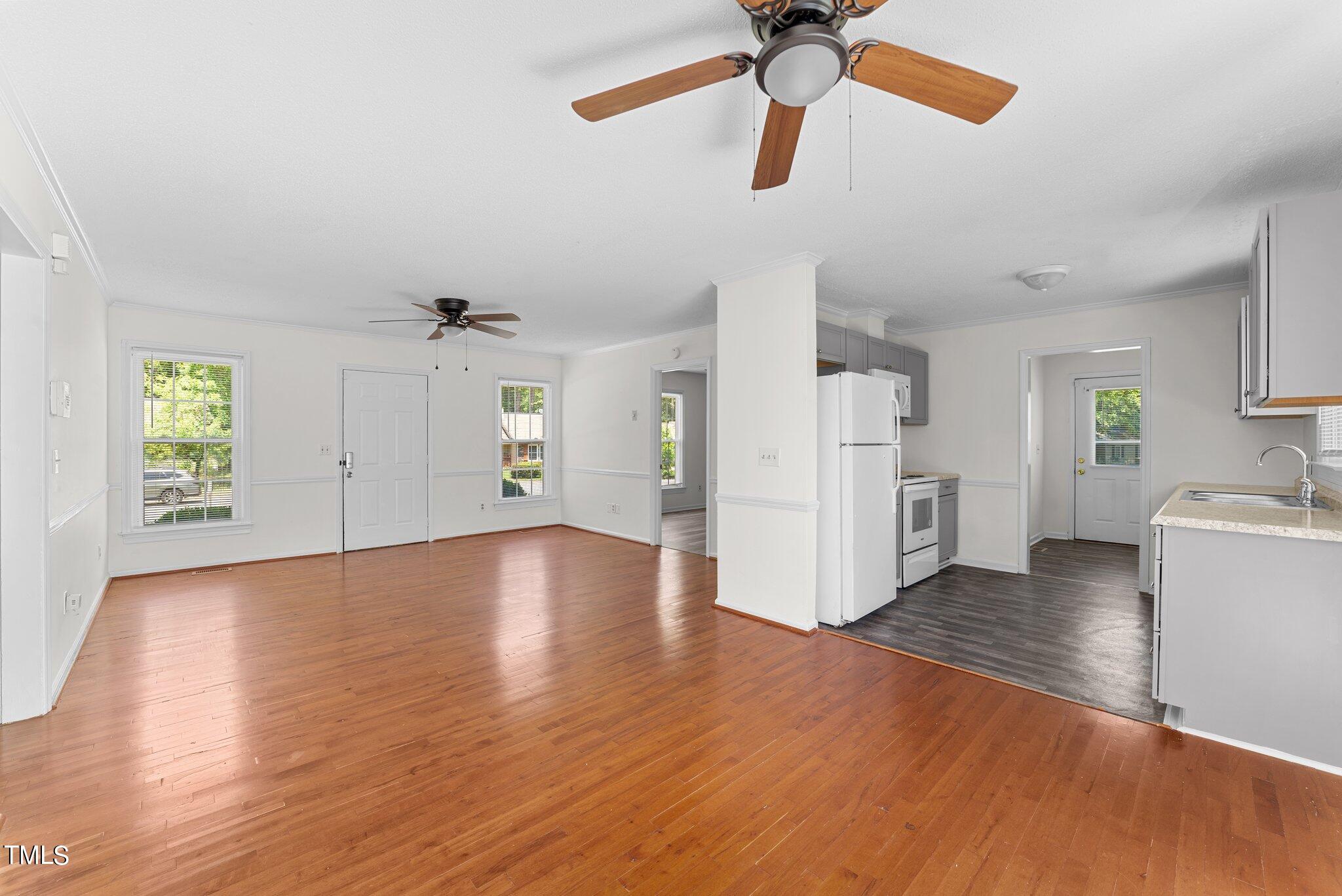 207 Freestone Road Greenville, NC 27834 - Photo 13 of 45 a view of empty room with wooden floor and window