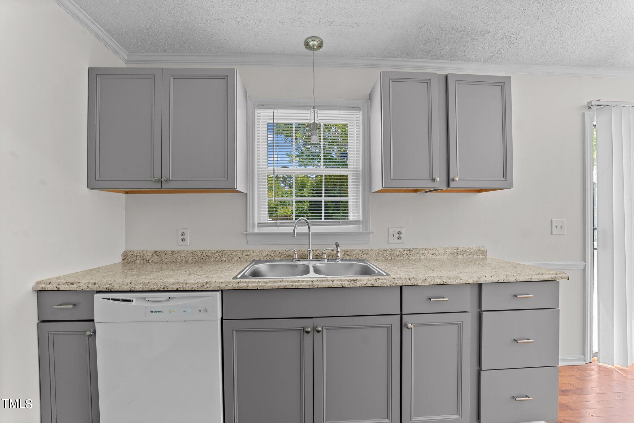 207 Freestone Road Greenville, NC 27834 - Photo 16 of 45 a kitchen with a sink cabinets and window