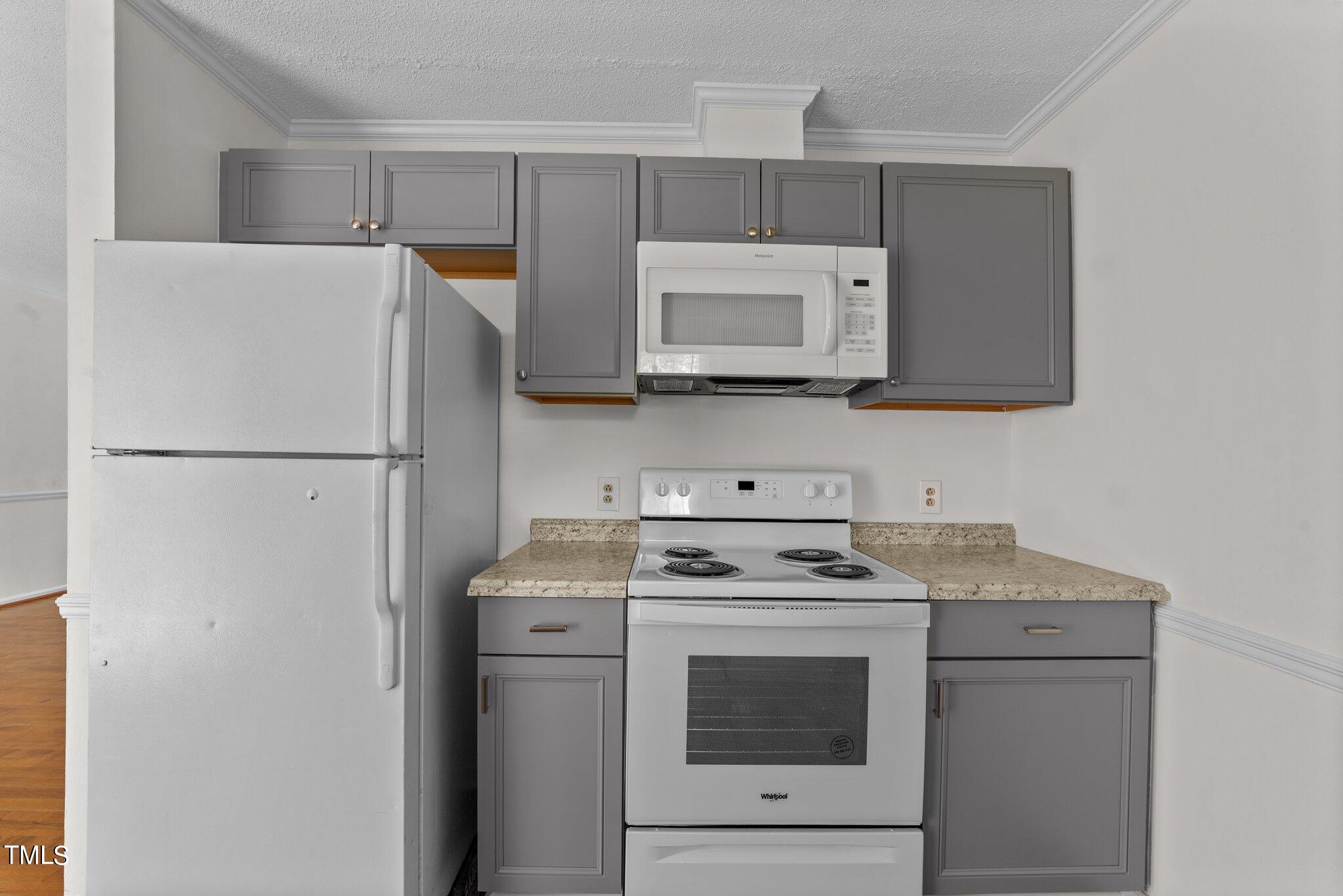 207 Freestone Road Greenville, NC 27834 - Photo 17 of 45 a kitchen with a stove microwave and refrigerator
