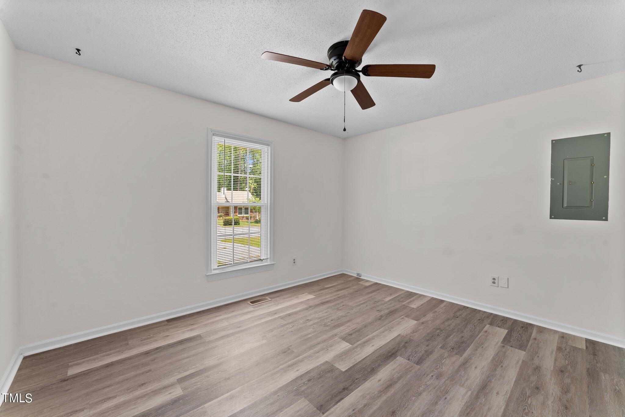 207 Freestone Road Greenville, NC 27834 - Photo 20 of 45 a view of a big room with wooden floor closet and windows