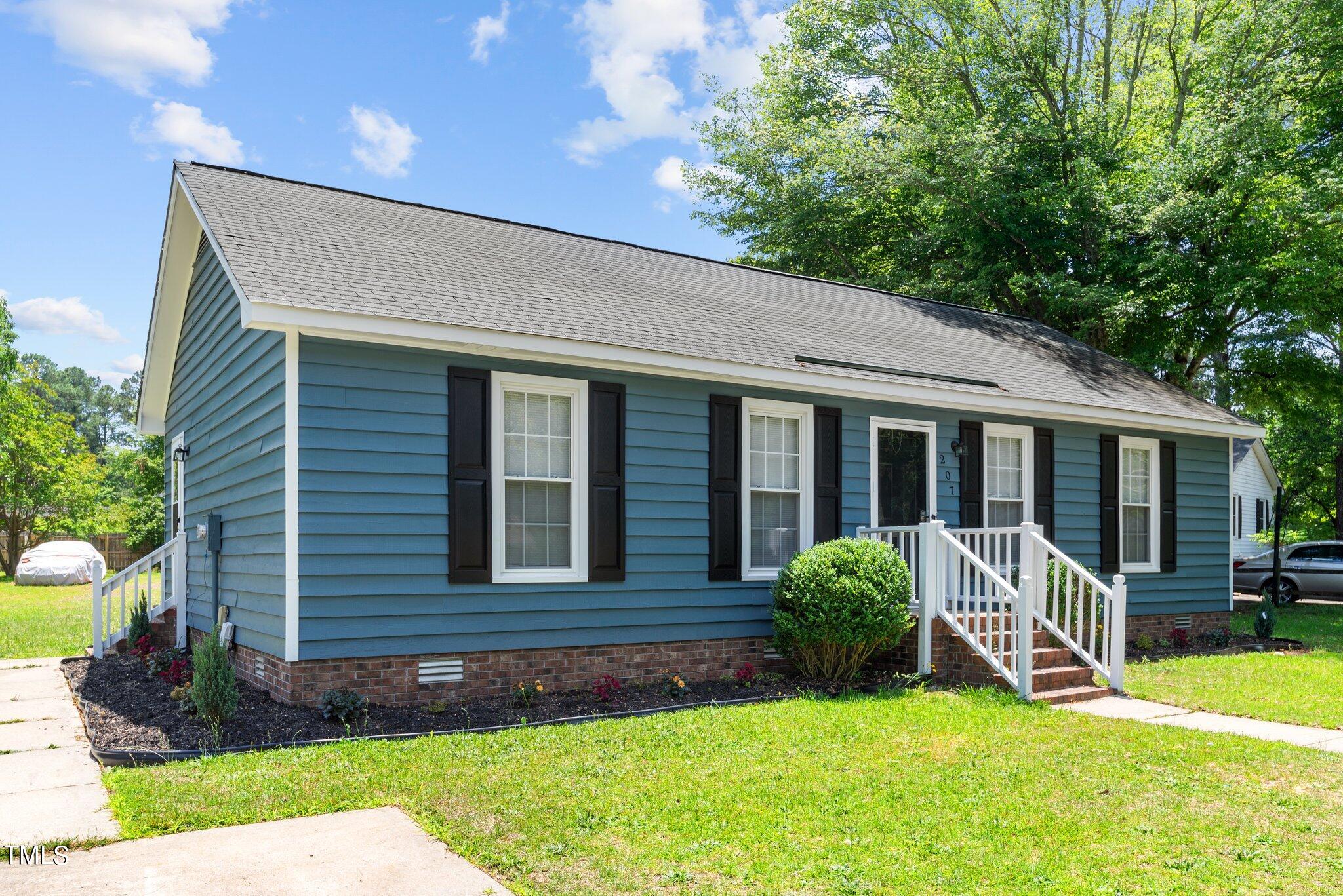 207 Freestone Road Greenville, NC 27834 - Photo 2 of 45 a view of a house with a yard and plants