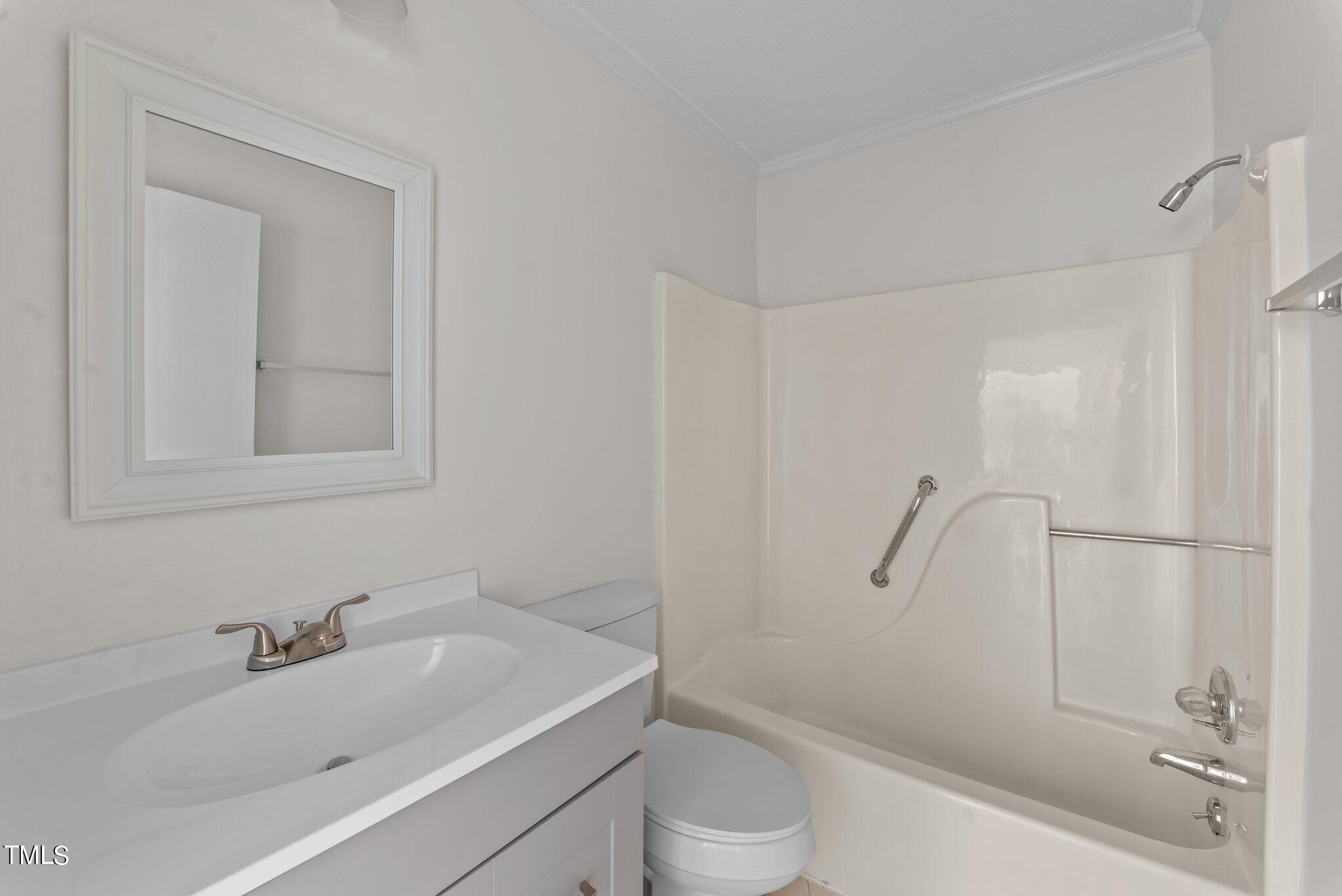 207 Freestone Road Greenville, NC 27834 - Photo 32 of 45 a bathroom with a sink a toilet and shower