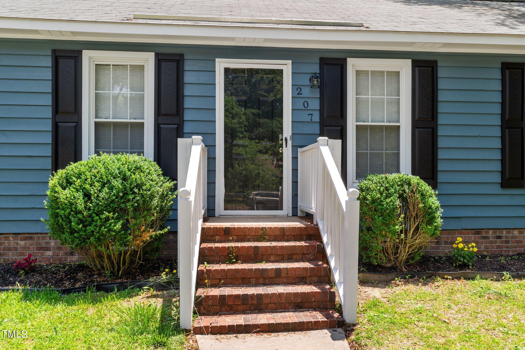 207 Freestone Road Greenville, NC 27834 - Photo 4 of 45 a view of a potted plants in front of a house