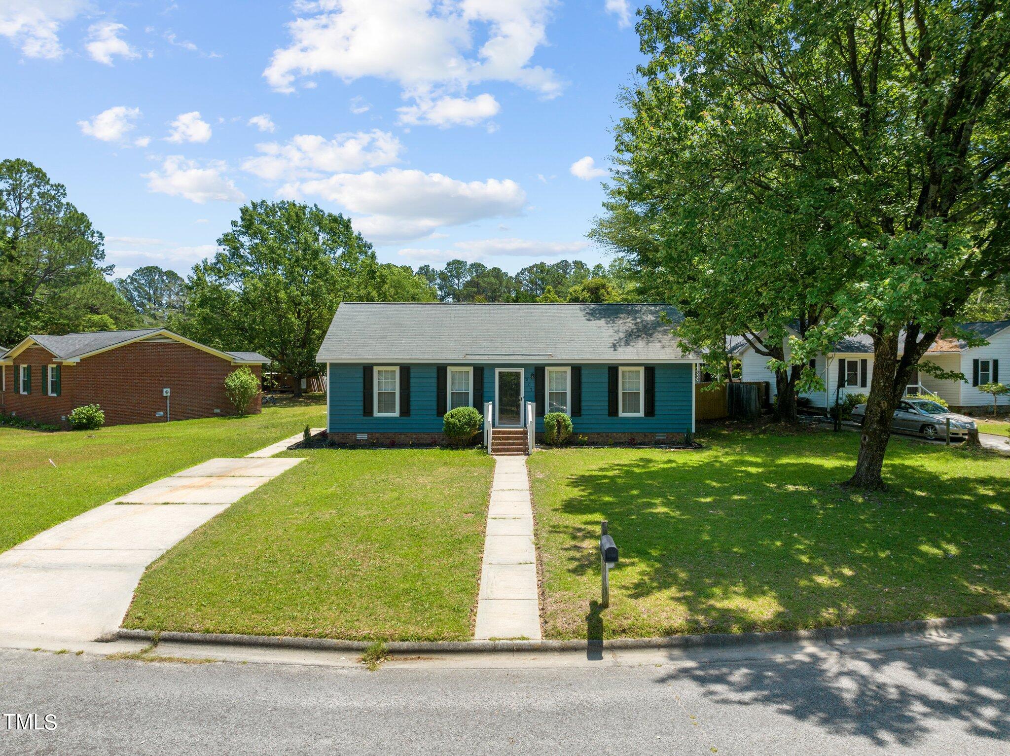 207 Freestone Road Greenville, NC 27834 - Photo 5 of 45 a front view of a house with a garden and yard