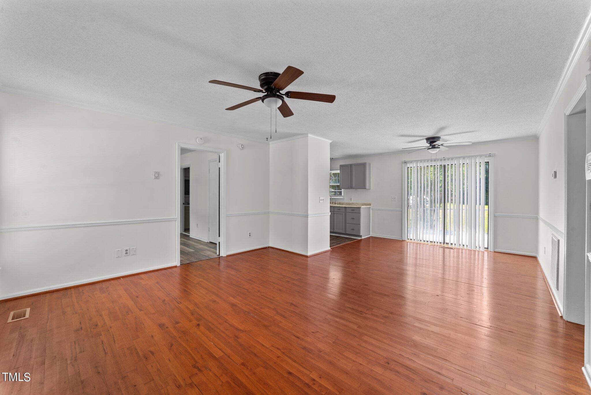 207 Freestone Road Greenville, NC 27834 - Photo 8 of 45 wooden floor in an empty room with a window
