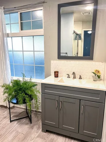 a bathroom with a sink and a mirror
