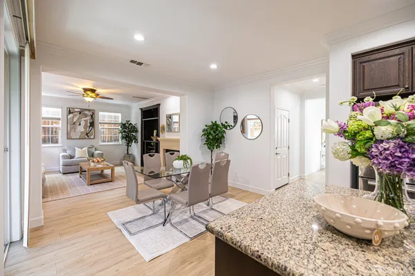 a kitchen with stainless steel appliances granite countertop a refrigerator and cabinets