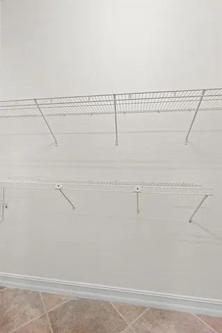a view of a room with racks on the wall