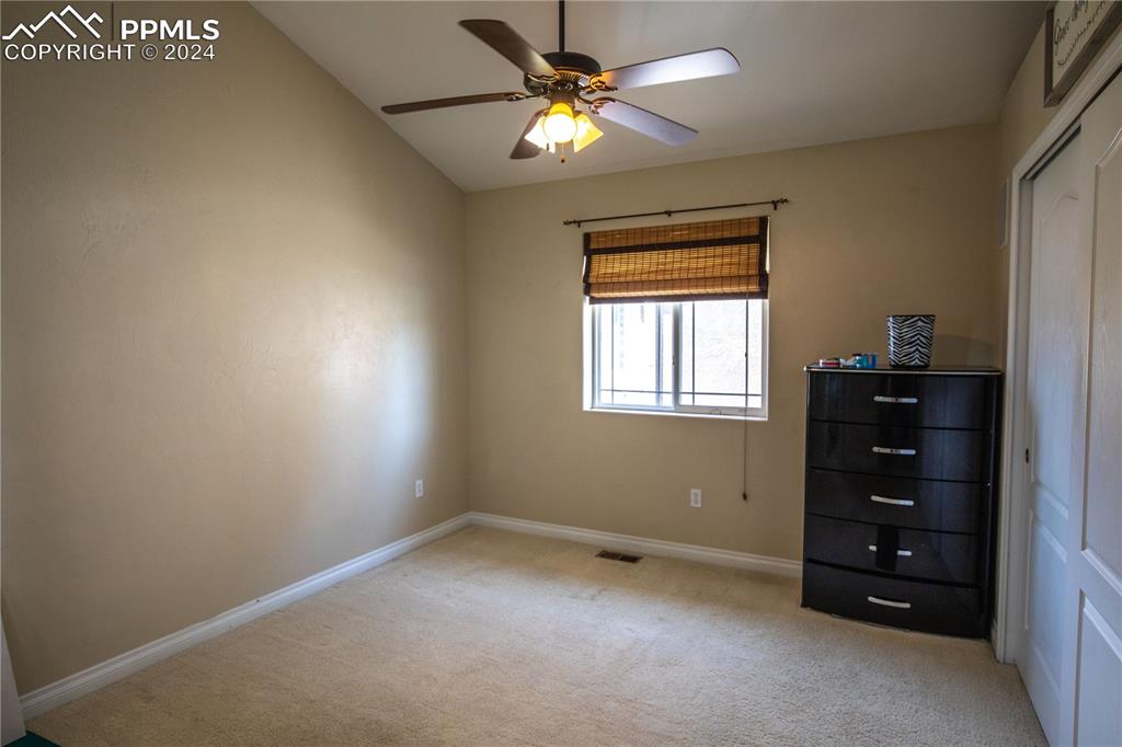 1510 York Road, Unit 103 Colorado Springs, CO 80918 - Photo 21 of 28 a room with window closet and ceiling fan