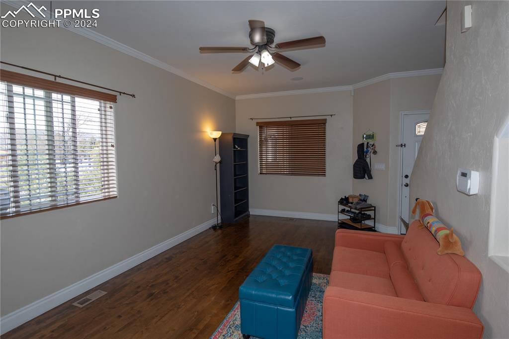 1510 York Road, Unit 103 Colorado Springs, CO 80918 - Photo 5 of 28 a living room with furniture and wooden floor