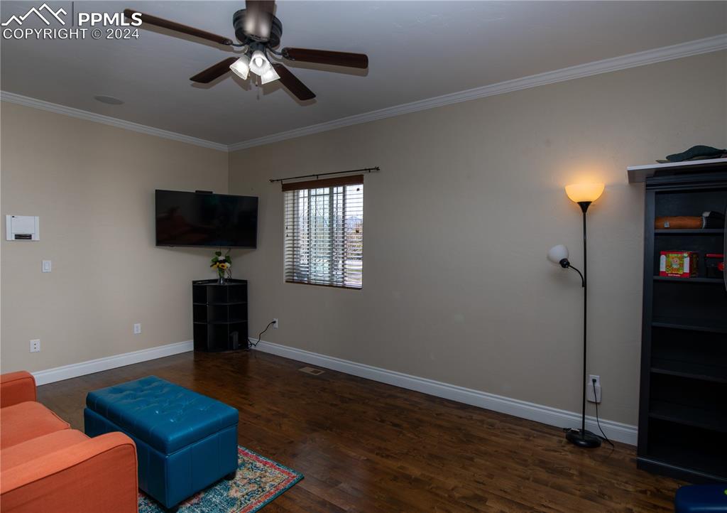 1510 York Road, Unit 103 Colorado Springs, CO 80918 - Photo 6 of 28 a living room with furniture and a flat screen tv