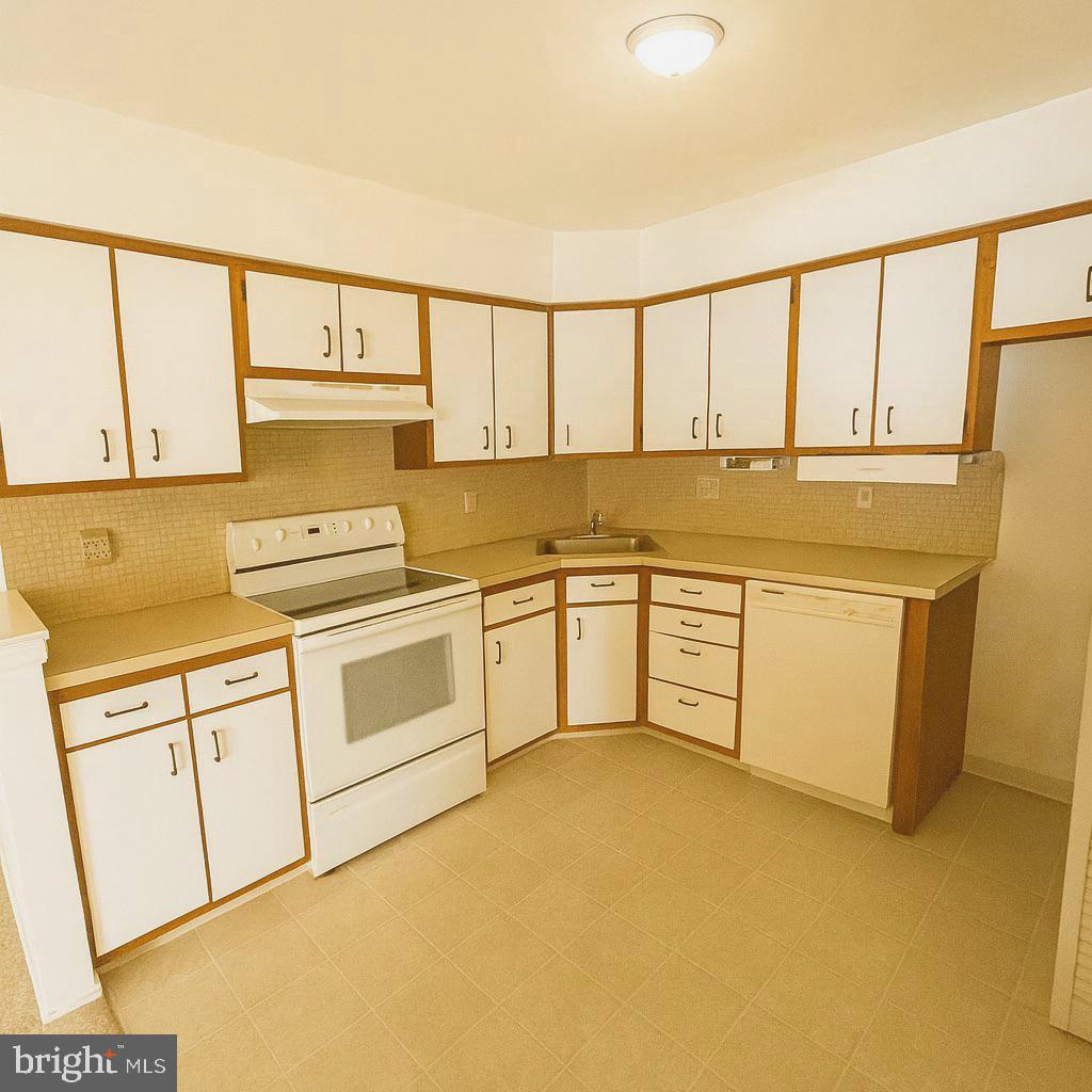 1 Windsor Court Sewell, NJ 08080 - Photo 11 of 21 a kitchen with a white cabinets and white appliances