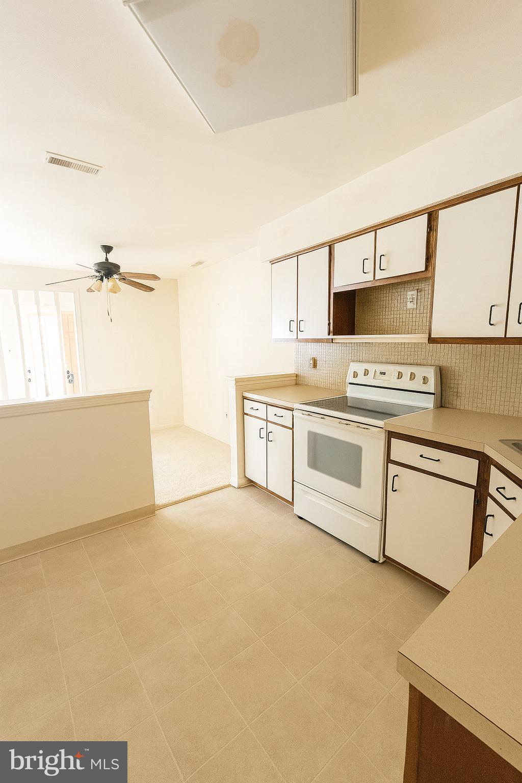 1 Windsor Court Sewell, NJ 08080 - Photo 14 of 21 a kitchen with a stove top oven and cabinets