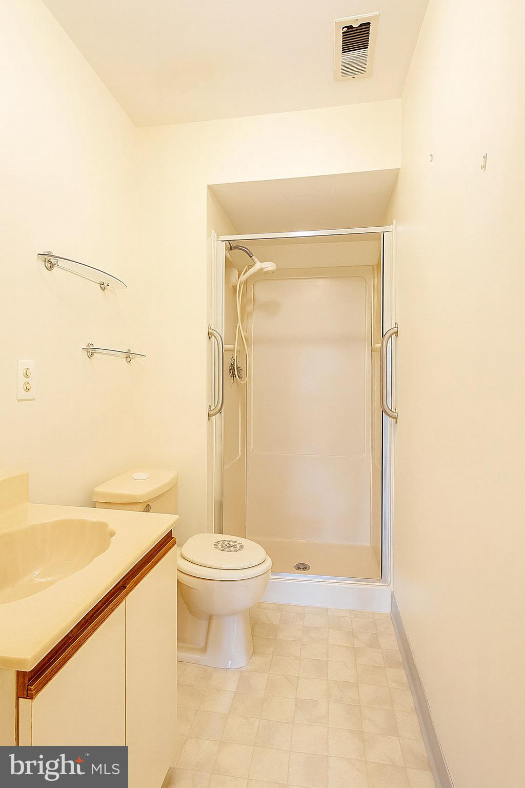 1 Windsor Court Sewell, NJ 08080 - Photo 19 of 21 a bathroom with a granite countertop sink toilet and shower