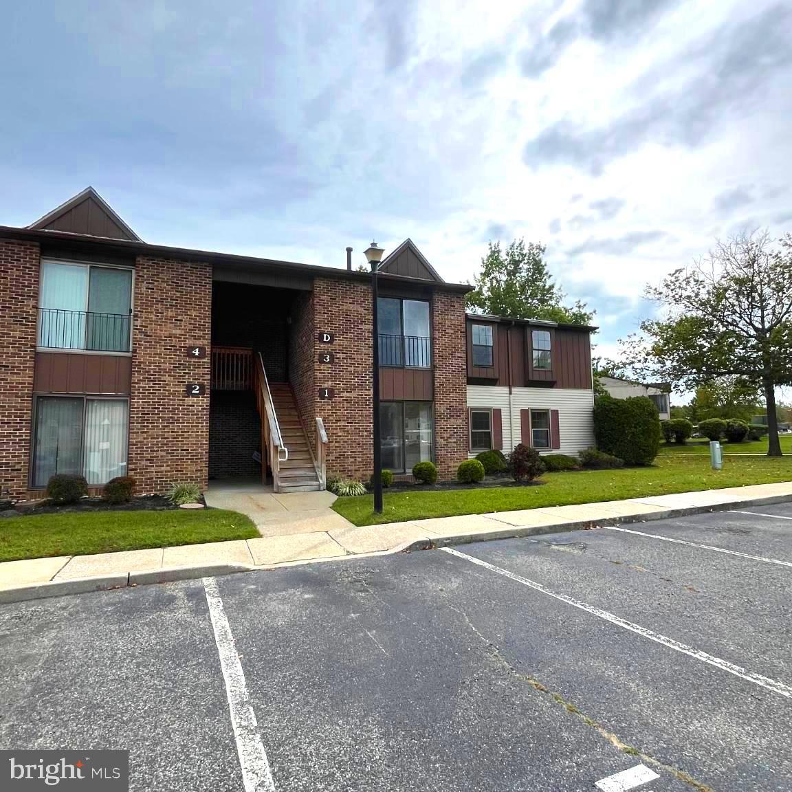 1 Windsor Court Sewell, NJ 08080 - Photo 2 of 21 a front view of a house with a yard and garage