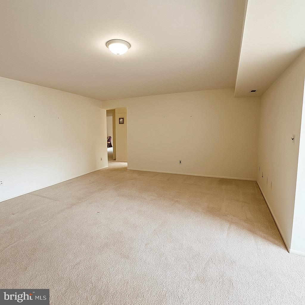 1 Windsor Court Sewell, NJ 08080 - Photo 10 of 21 an empty room with a natural light