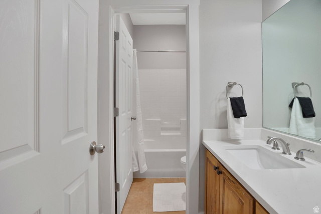 1570 South Rio Virgin Drive Washington, UT 84780 - Photo 40 of 71 Bathroom featuring vanity, shower / tub combo with curtain, and light tile patterned floors