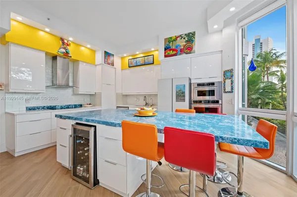 a kitchen with stainless steel appliances granite countertop a sink and a stove top oven