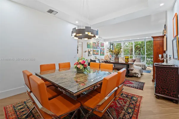 a dining room with a table or chandelier and a dining table