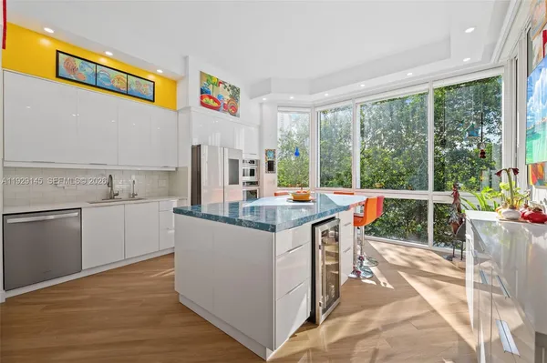 a kitchen with stainless steel appliances a stove and a microwave