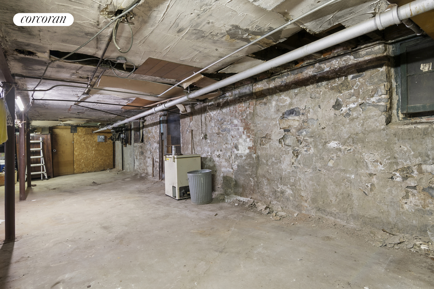 139 Schenectady Avenue Brooklyn, NY 11213 - Photo 10 of 13 a view of a empty room with wooden walls