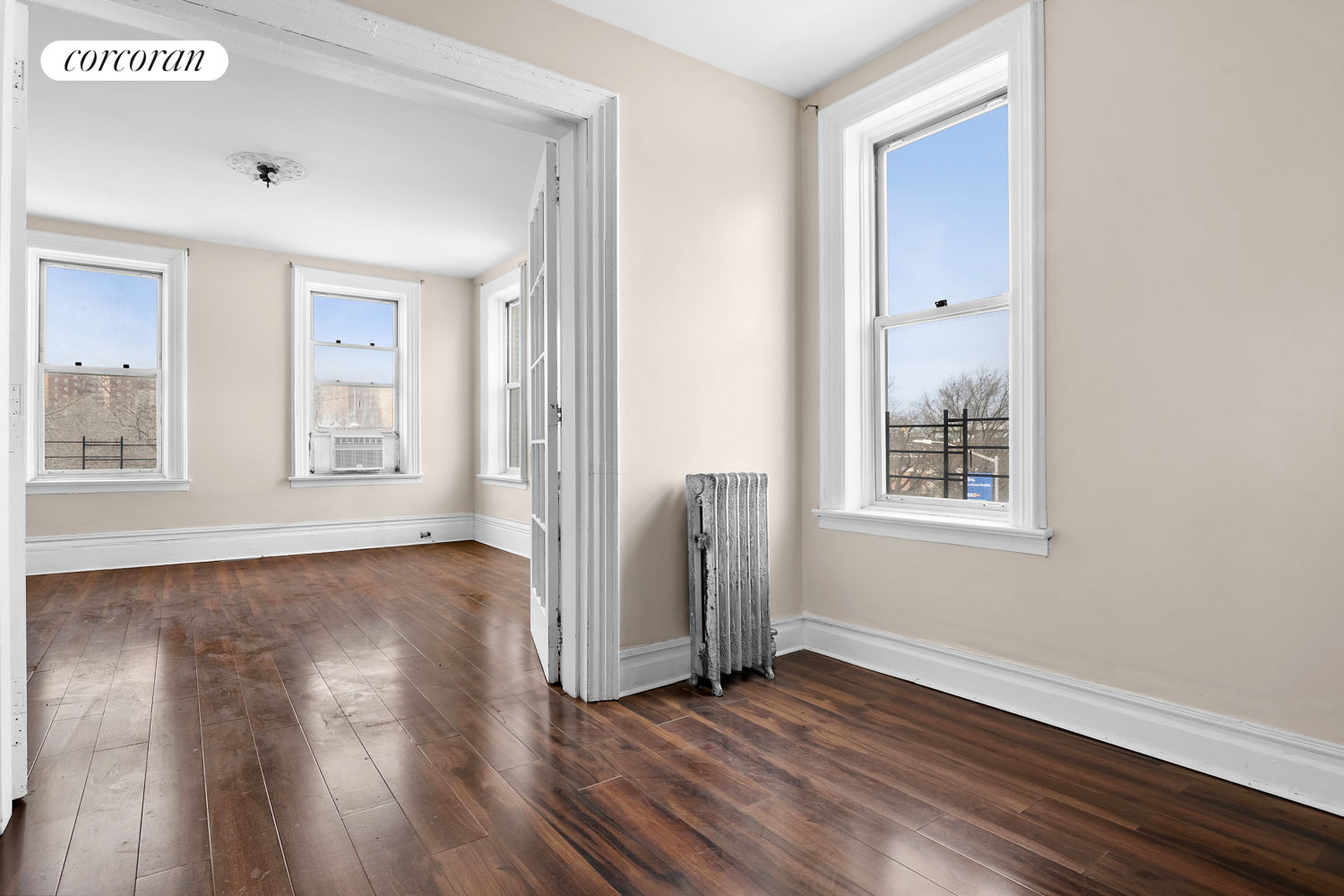 139 Schenectady Avenue Brooklyn, NY 11213 - Photo 5 of 13 a view of an empty room with wooden floor and a window