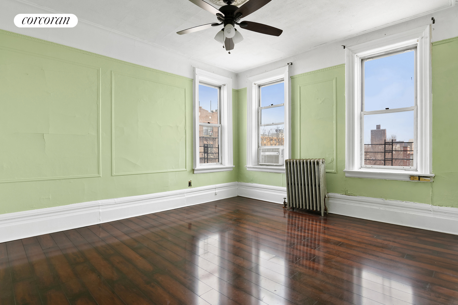 139 Schenectady Avenue Brooklyn, NY 11213 - Photo 7 of 13 a view of an empty room with window and wooden floor