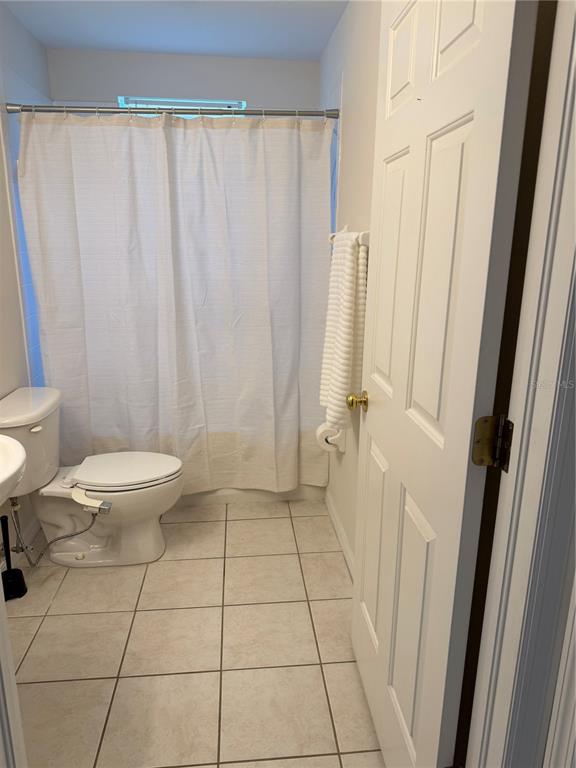 10760 Plantation Bay Drive Tampa, FL 33647 - Photo 14 of 39 a bathroom with a toilet and a shower